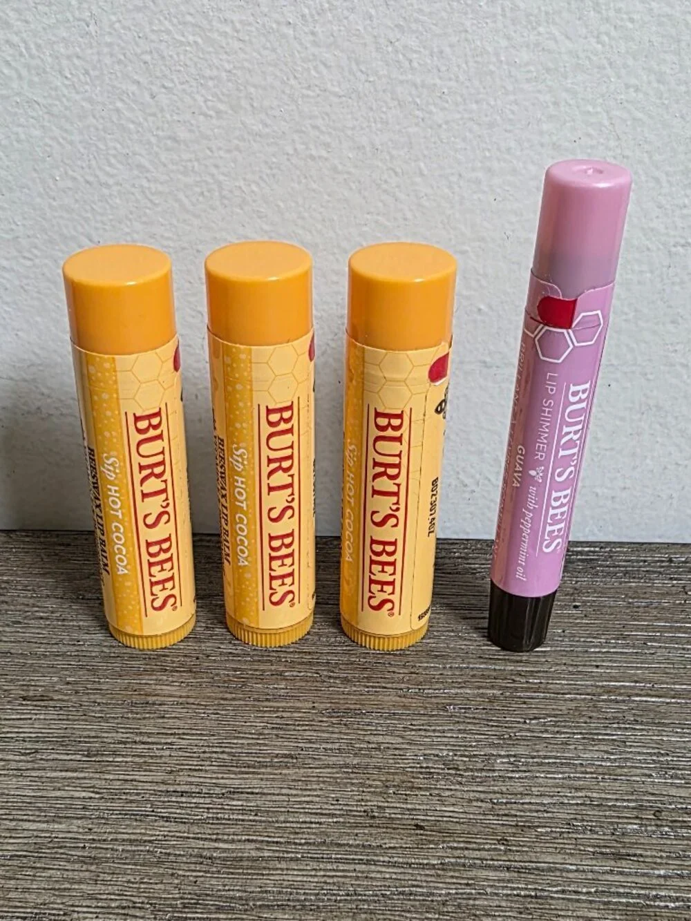 Three (3) Burt's Bees Hot Cocoa Lip Balm and One (1) Lip Shimmer Guava SEALED